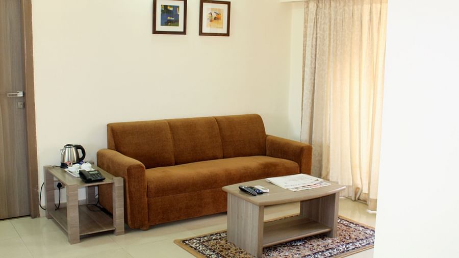 A front view of a brown couch and coffee table in the living room