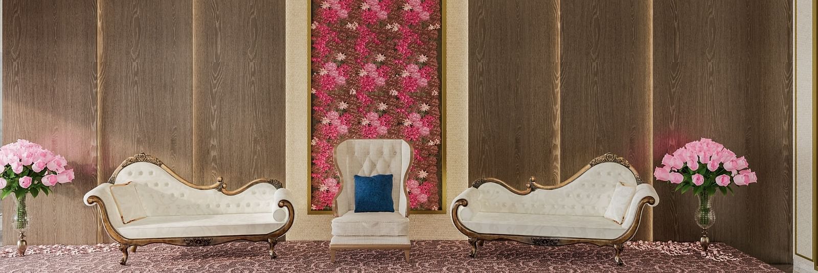 A regal lounge with floral decor, a white sofa, and gold accents at Town Square Suites.