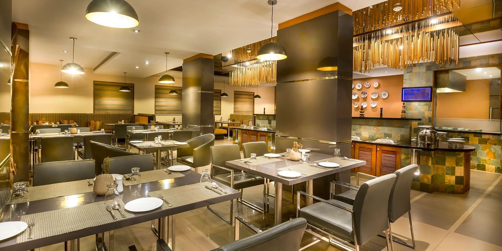  Modern restaurant interior with dark wood accents, leather chairs, and ambient lighting.