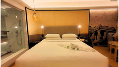 Luxurious superior room featuring a comfortable king-size bed and ambient lighting
