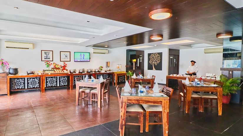 Side angle view of restaurant with multiple chairs and modern interior - Clarks Collection, Vadodara