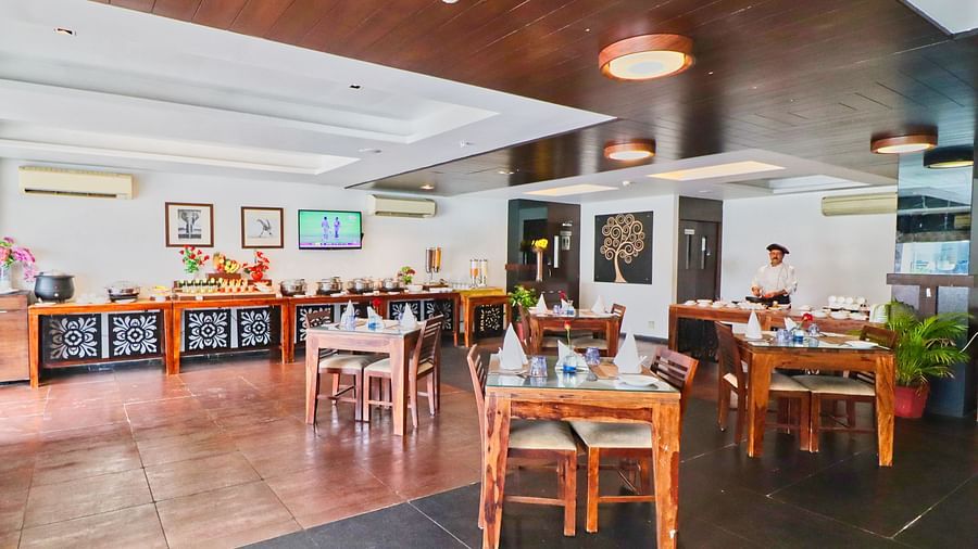 Side angle view of restaurant with multiple chairs and modern interior - Clarks Collection, Vadodara