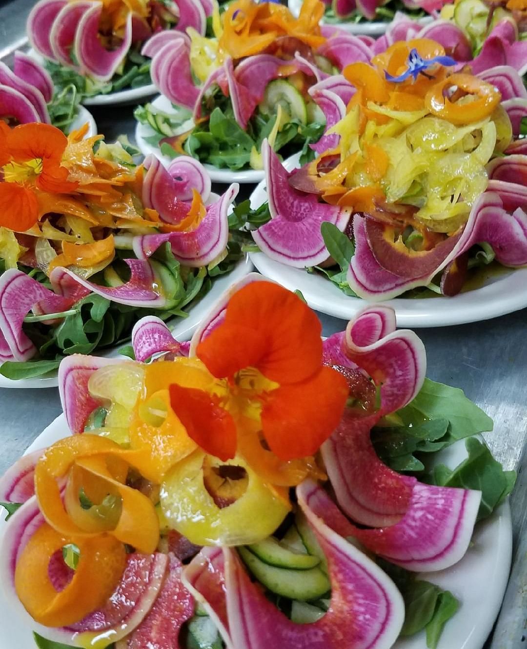 Colorful deviled eggs garnished with edible flowers - Brewery Gulch Inn & Spa