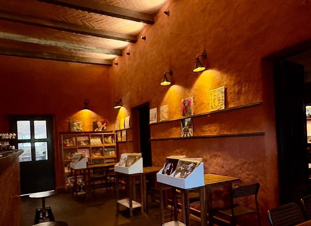 For The Record – Vinyl Bar featuring vinyls on the shelf under ambient lighting