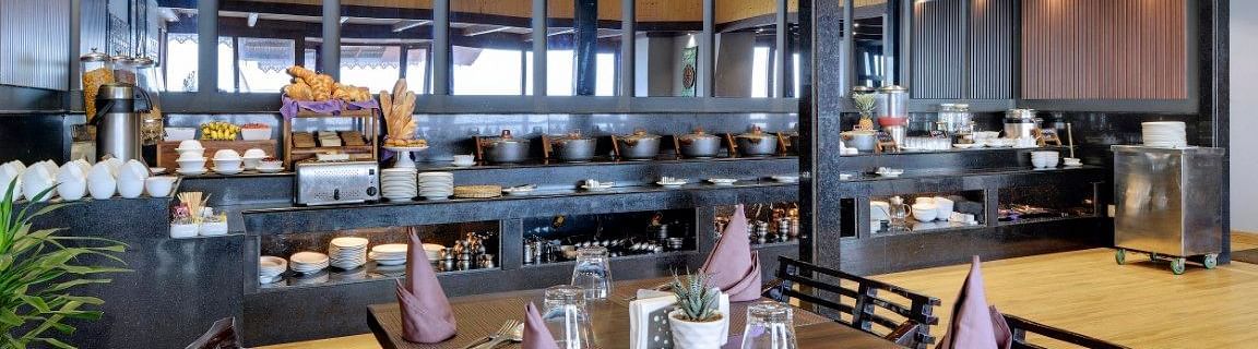 An image of the blue charcoal restaurant with seating arrangement - Sumitel Vista TV Tower