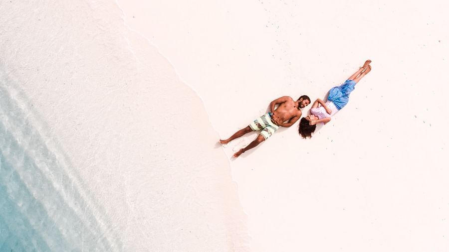aerial view Couple lying on a beach