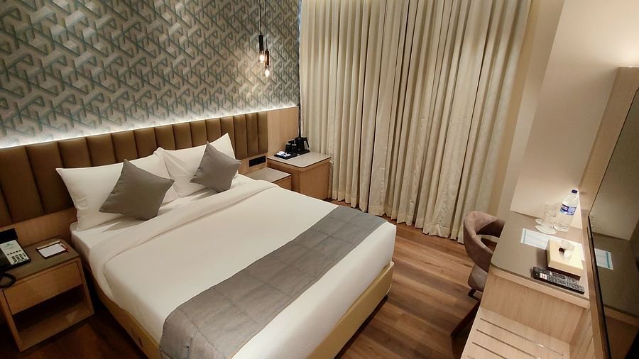 Wide angle view of deluxe room at Maxxvalue Hotel MIDC,  Mumbai