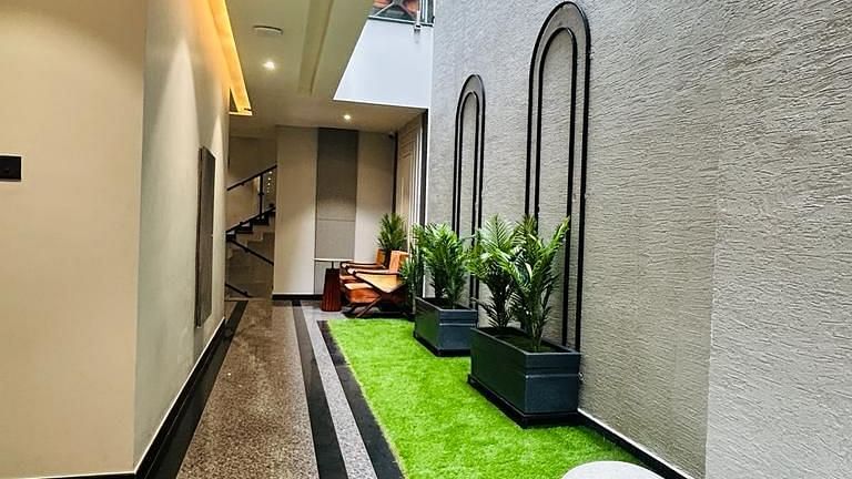 A lobby area with seating arrangements at Five Elements Hotels Goldleaf, Haldwani