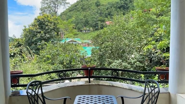  Steel chairs and tables with elegant designs are placed on the balcony for enjoying the view