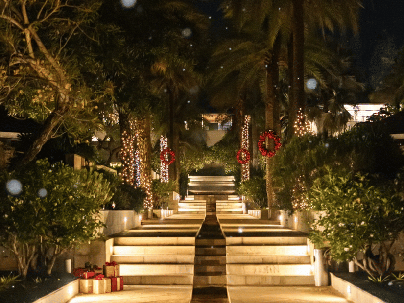 The Serai resort pathway illuminated with warm lights for the Christmas celebration.