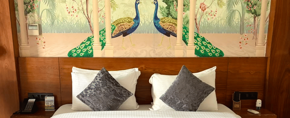 Sky Suite, Peacock mural headboard and bedside lamps
