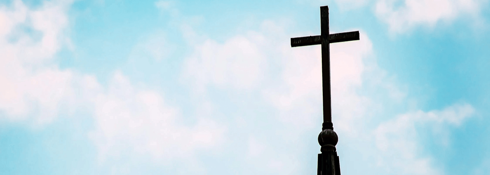 A cross set against a clear background.