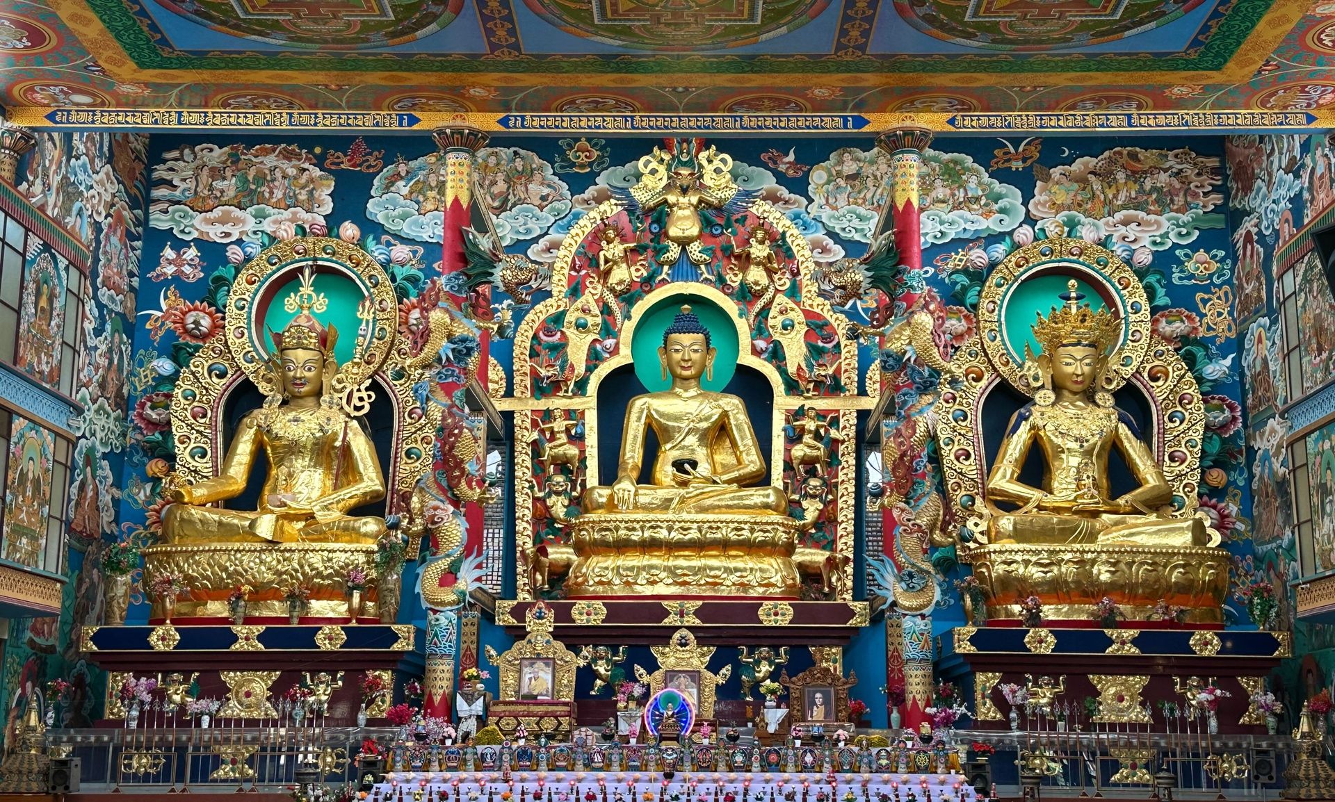 Golden Buddha statues at Namdroling Monastery.