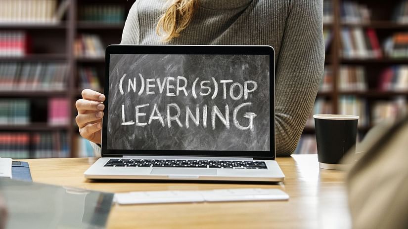 A laptop screen that reads never stop learning
