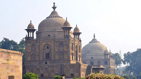 Historic mausoleum complex with domed architecture and garden.