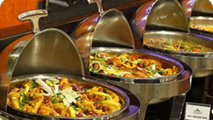 Image of a table with pots filled with food.