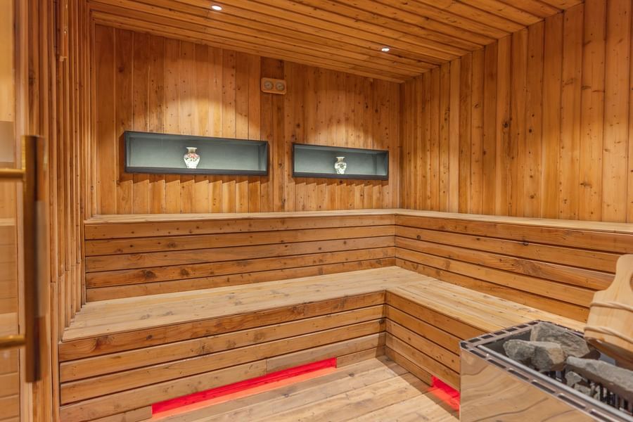 An image of the Sauna with a seating arrangement for relaxation - The Manor Luxury Hotel, Shimla