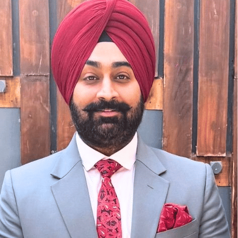 Cluster General Manager in suit and tie at Pride Hotels Group.