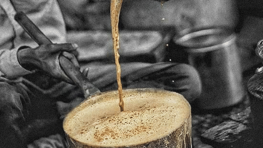 a man pouring cutting chai in a vessel
