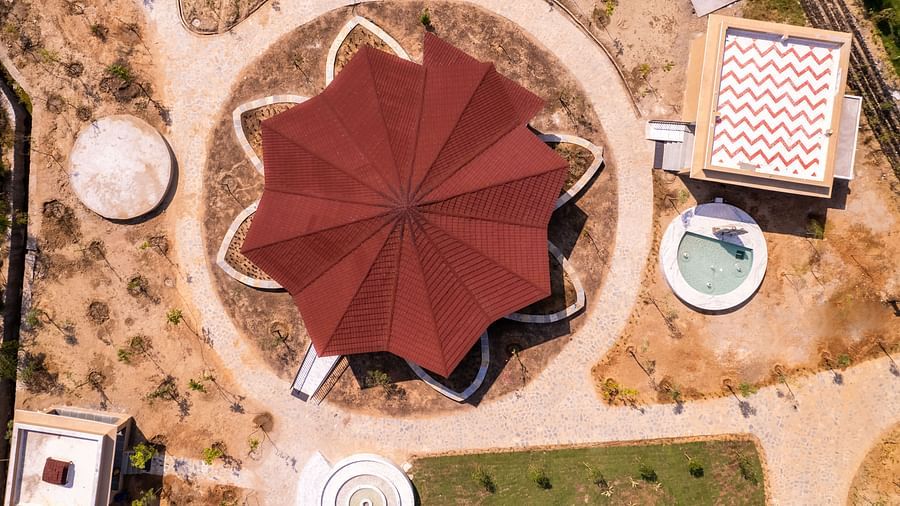 An aerial shot of a building with a roof coloured in red - Rajbagh Wellness, Udaipur