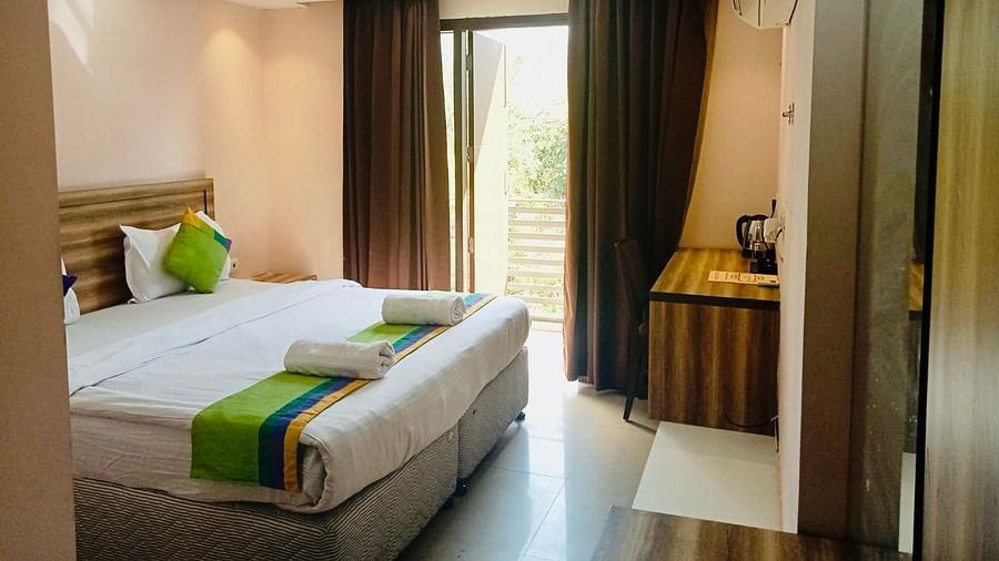 Aval International Gurugram Aval international - interior view of the suite featuring a king size bed an air conditioner and a study table