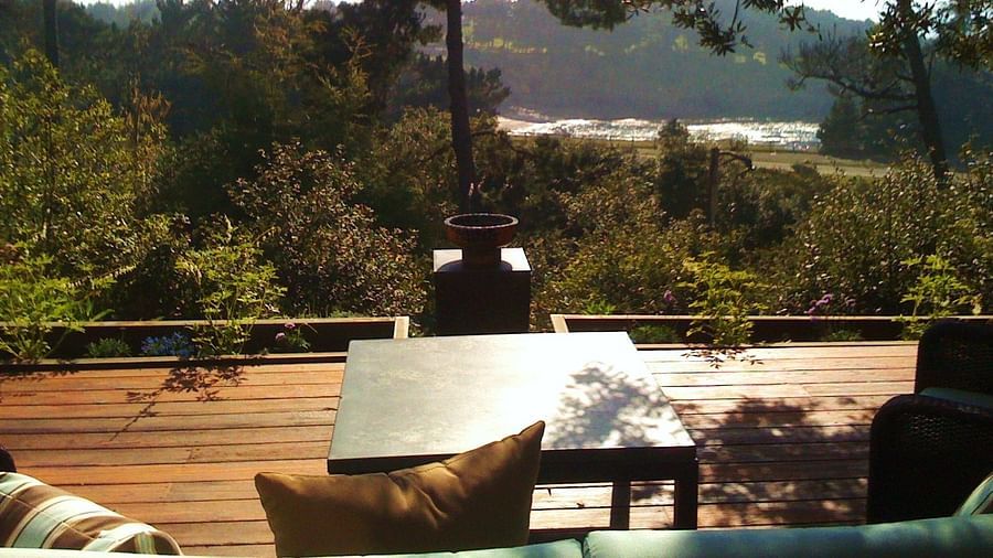A peaceful outdoor lounging spot with a valley backdrop - Brewery Gulch Inn & Spa