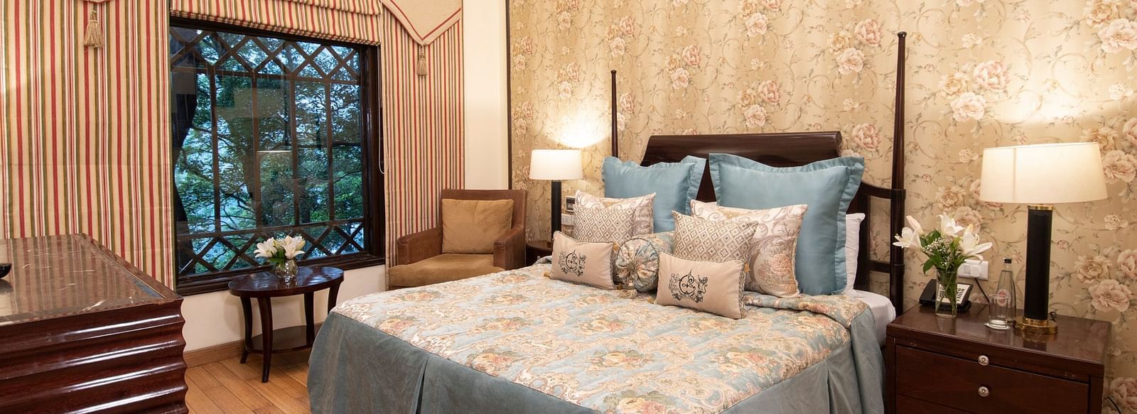 view of the king sized bed in a duplex family suite at the Claridges Nabha Residence, Mussoorie