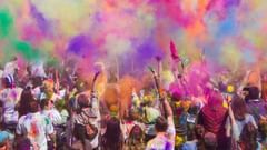 Large crowd celebrating holi with colours
