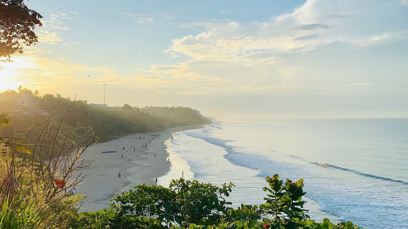 view of a beach with waves crashing the shore
