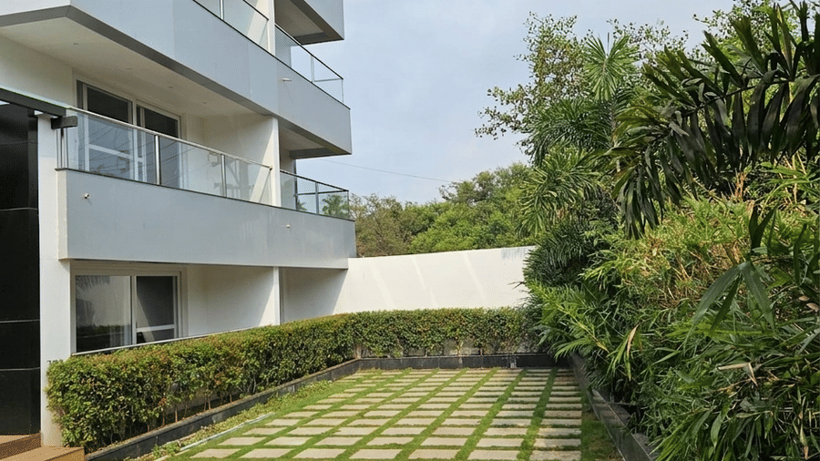 Backyard showing a small section of a pool and a courtyard garden at BluSalzz Collection - Casa Onze, Arpora.