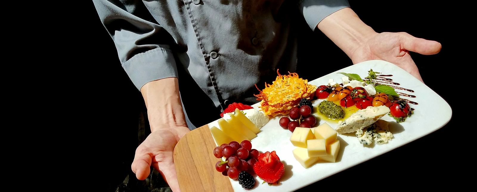 A chef presenting a beautifully plated dish with care - Brewery Gulch Inn & Spa