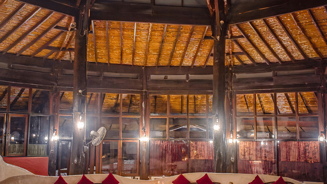 Indoor dining area with a unique domed ceiling and elegant table settings.