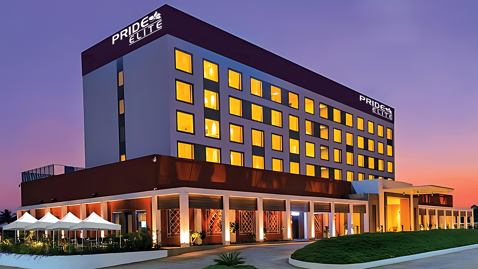 A facade image of the Pride Elite Phaltan with a dusky sky in the background