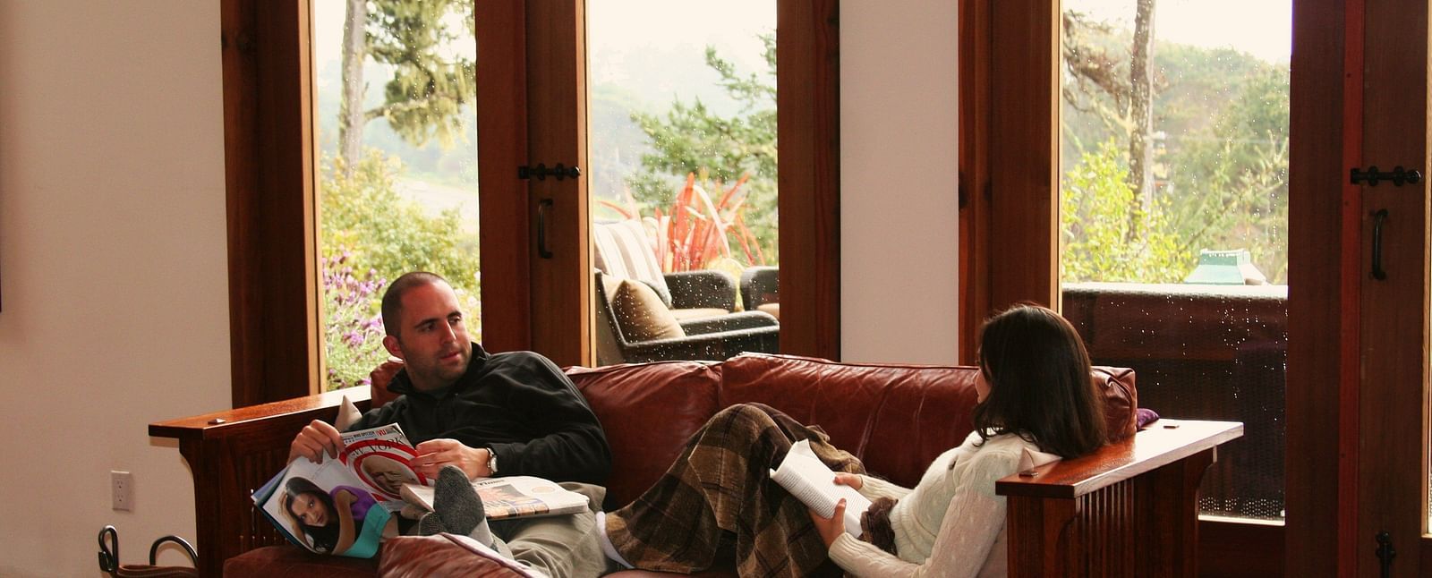 A cozy seating area with a couple enjoying the warmth and atmosphere of the space - Brewery Gulch Inn & Spa