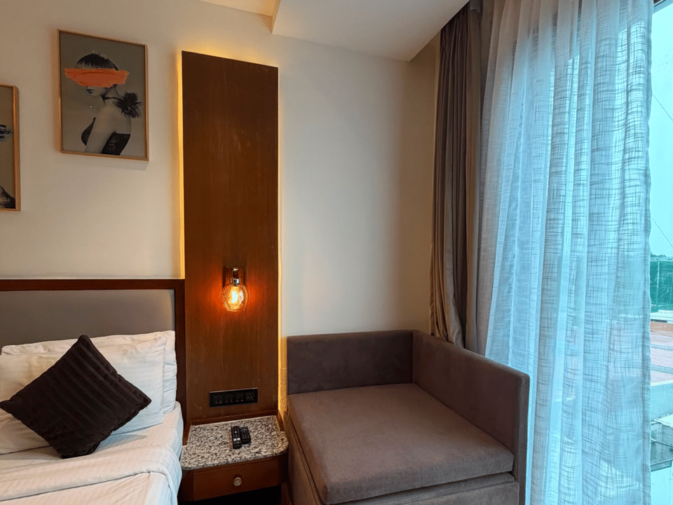 Deluxe Pool Room, Day bed beside the sheer-curtained window