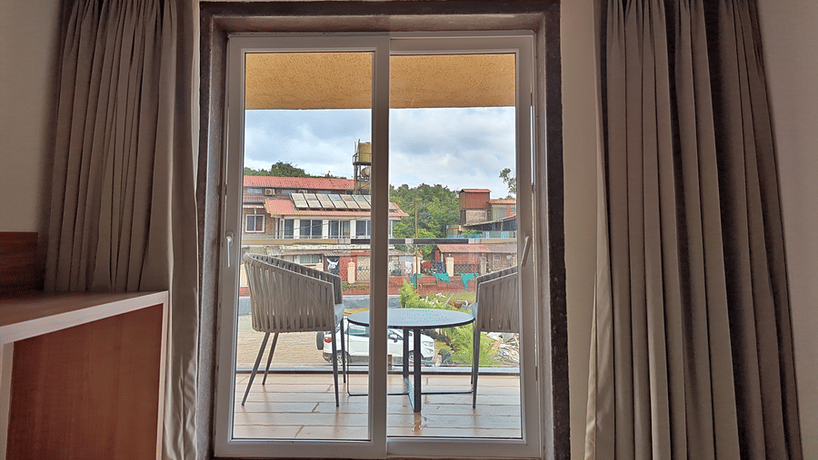 Room window overlooking surrounding buildings and outdoor scenery