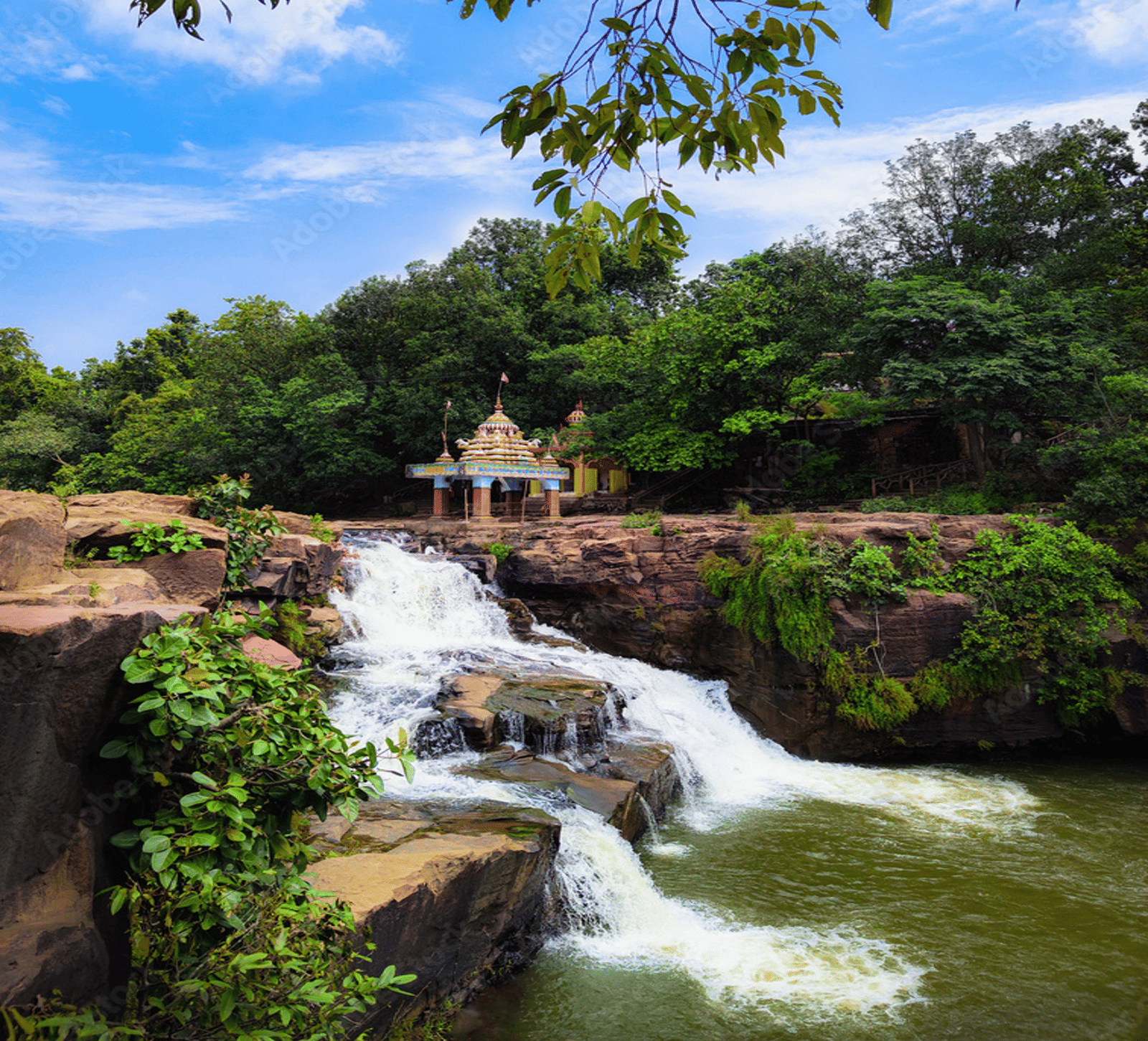Scenic Koilighugar Waterfall surrounded by lush greenery near Jharsuguda