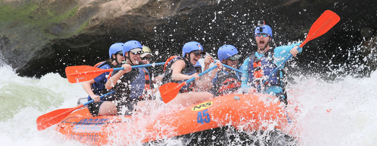 An exhilarating whitewater rafting adventure on a turbulent river with a group of six in an inflatable raft.