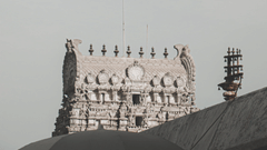a far away image of Bhoo Varaswamy Temple with dark skies in the background