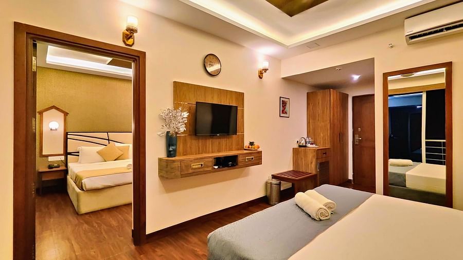 Image of family room inter-connected with bed and door leading to another room at Vagator Downtown, Goa 