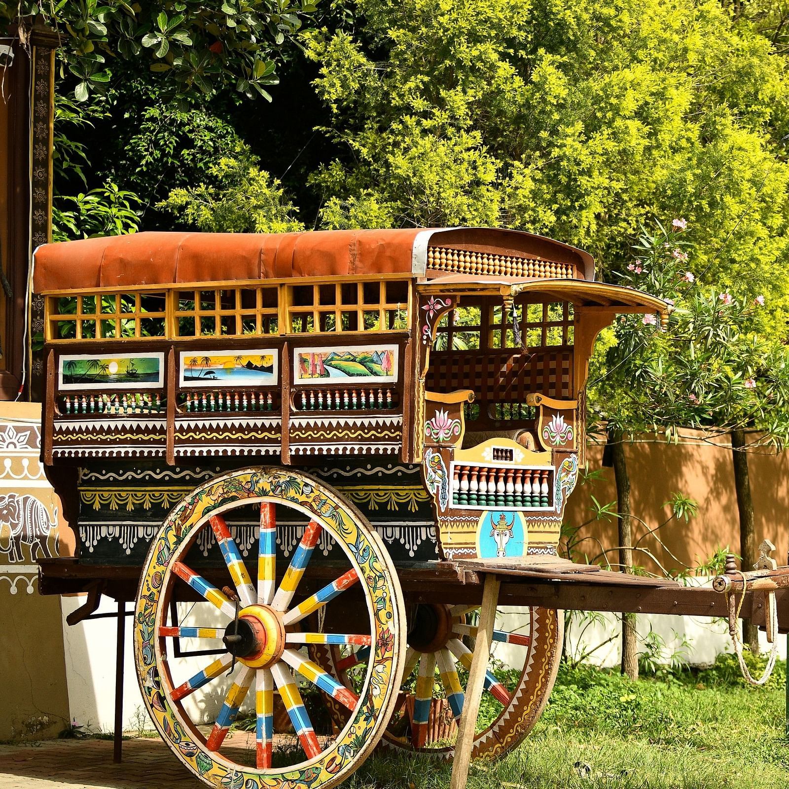 image of a wooden bullock cart at hoysala village resort, hassan