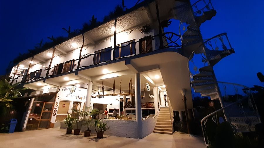 A low high exterior view of the hotel facade that is well-lit | Matsya Island Retreat