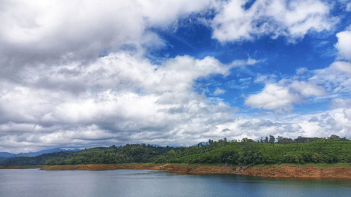 The lush green pastures surrounding the lake near Sholayar dam Pollachi - Weekend places near Coimbatore 