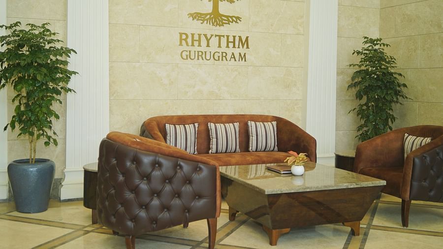 Seating arrangements inside the lobby at Rhythm Gurugram 