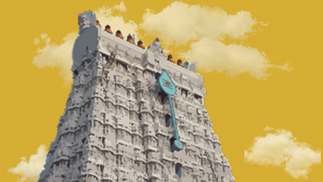 An extreme close-up of a large white temple gopuram with intricate carvings under a cloudy sky.