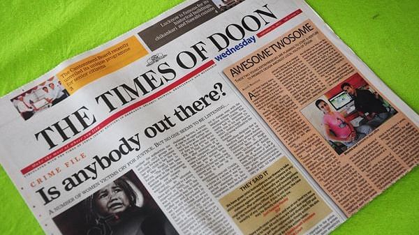 A newspaper with the headline Is anybody out there?
