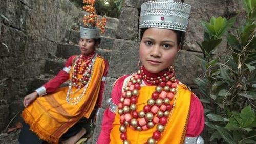 two people dressed in their native dress of Cherrapunjee
