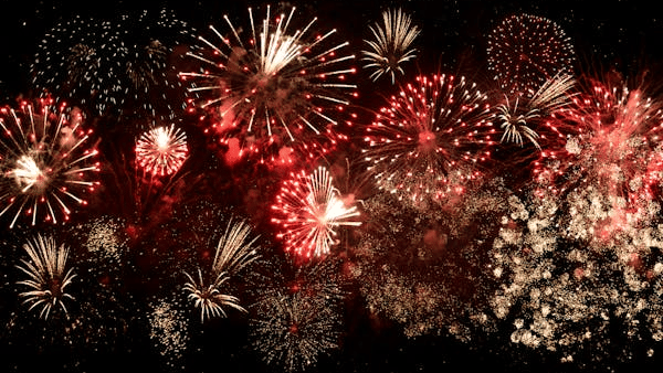 Variety of colorful fireworks exploding in different patterns - New Year Celebration Kochi.