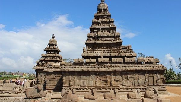 A stone temple structure with 2 towers, multiple sculptures and carvings near Hotel Mamallaa Heritage, Mahabalipuram.