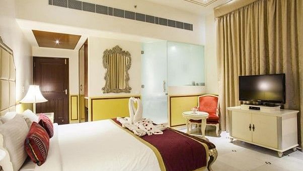 Image of a room with a bed and a television in front at Rajasthali Resort & Spa Jaipur.